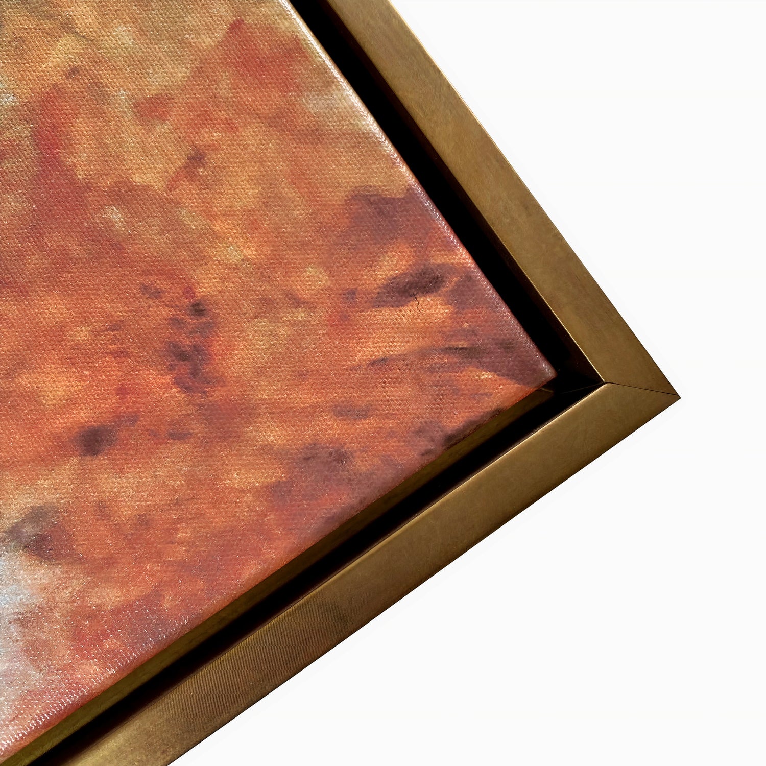 Close-up of a painting with a textured surface and gold frame on a white background