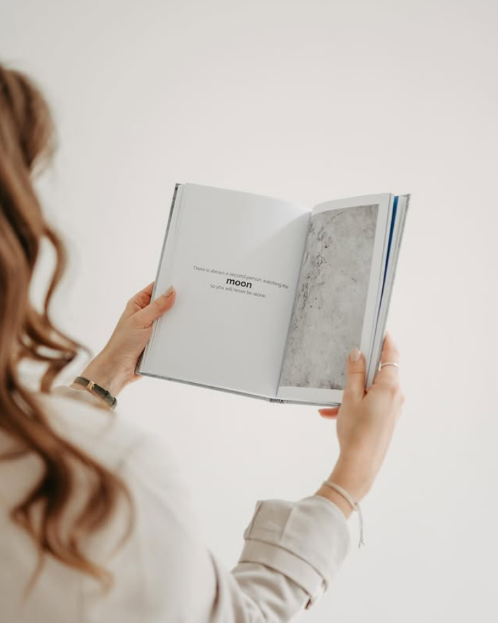 Author Elisabeth Wittauer holding her book "Moonshine thoughts". Image credit: Elisabeth Wittauer.