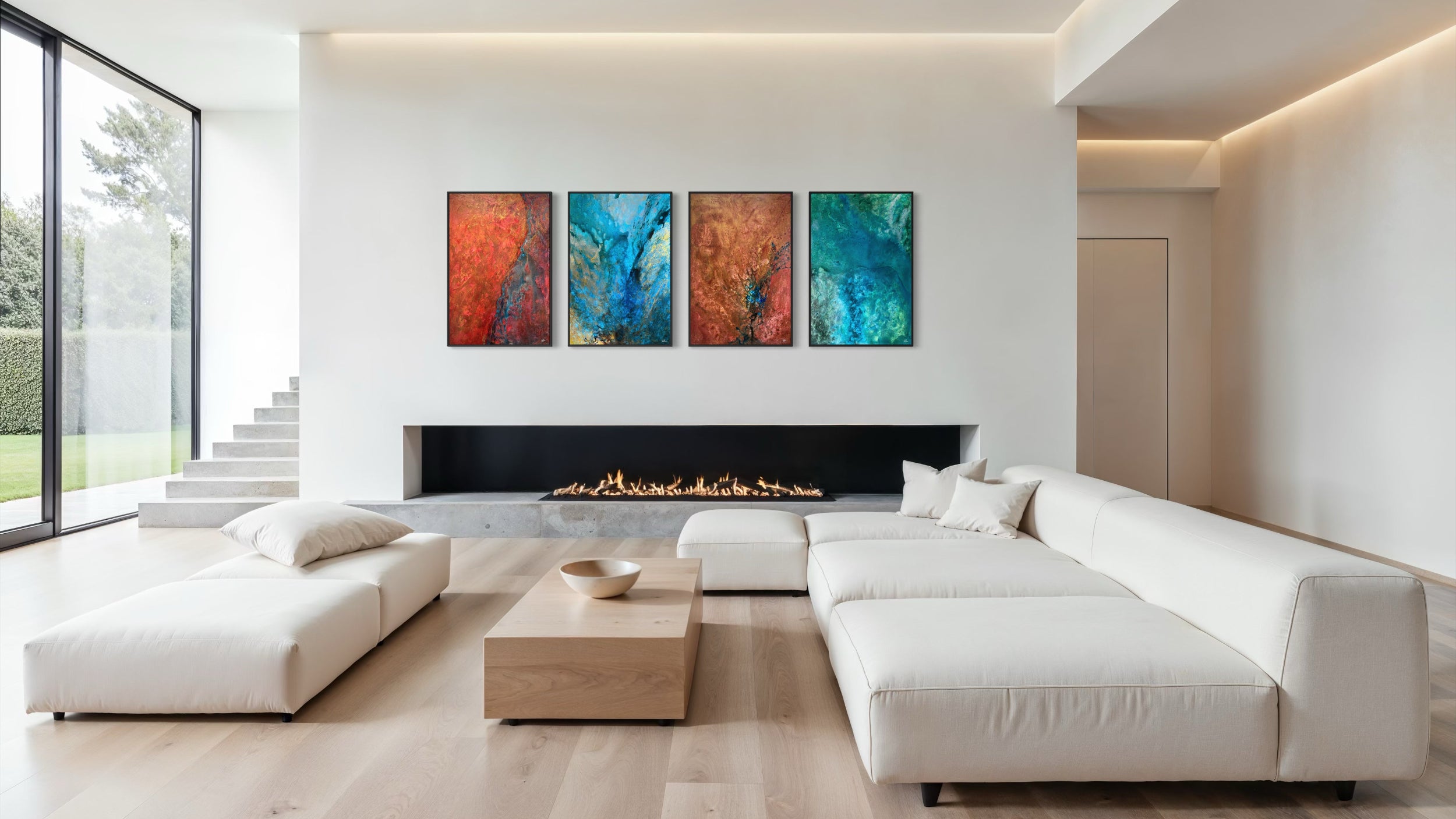 Modern living room with white sofa, coffee table, and colorful abstract art above a fireplace.