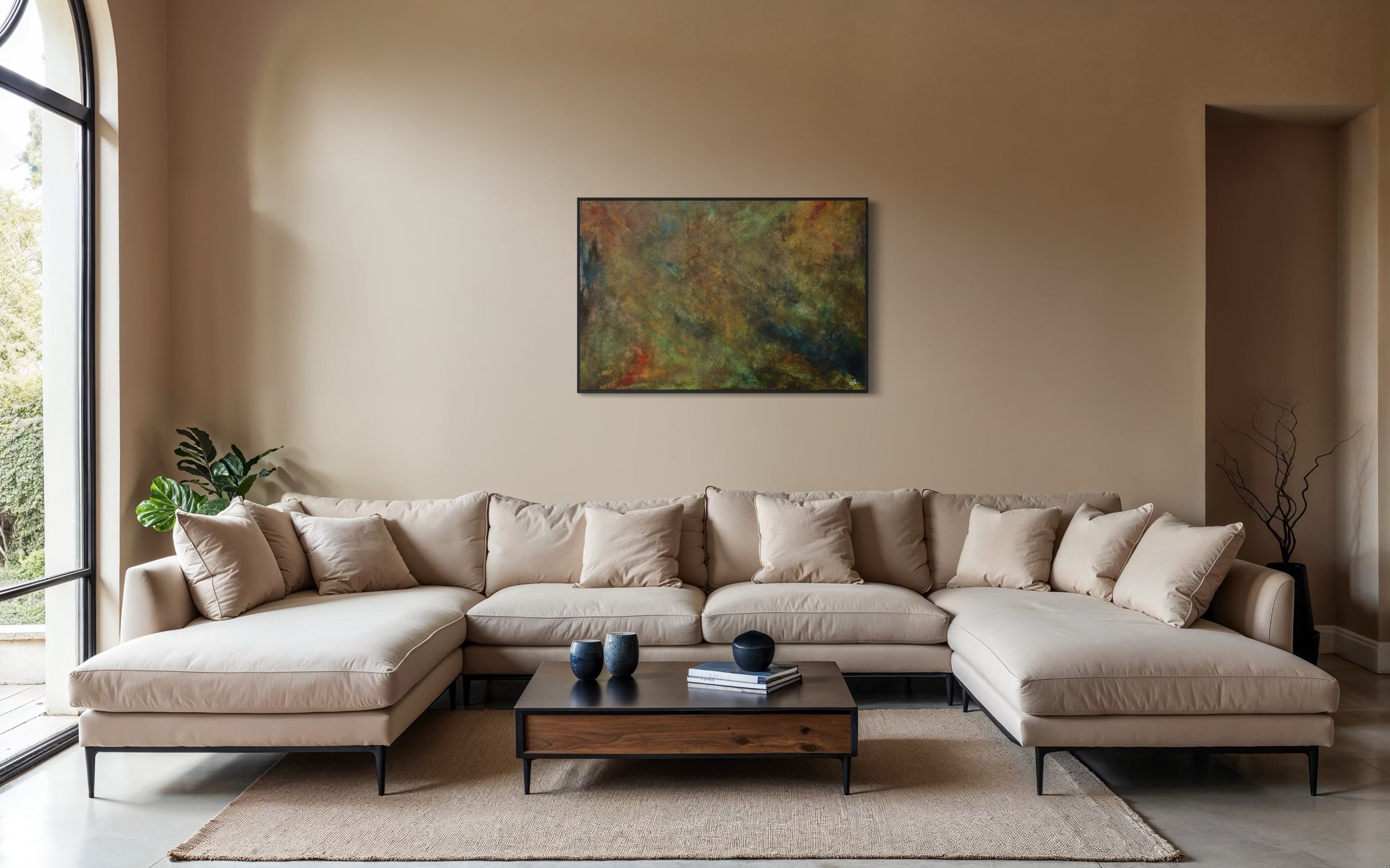 Beige sectional sofa in a living room with a painting on the wall.