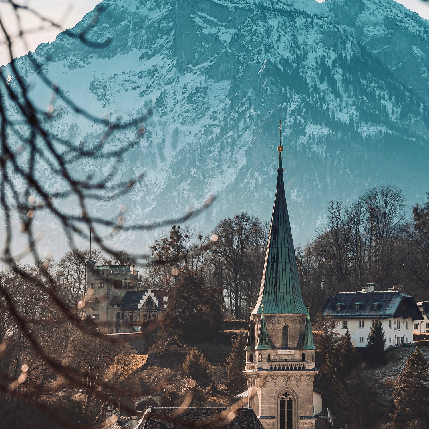 Image of a church with a mountain behind it in Salzburg, Austria.