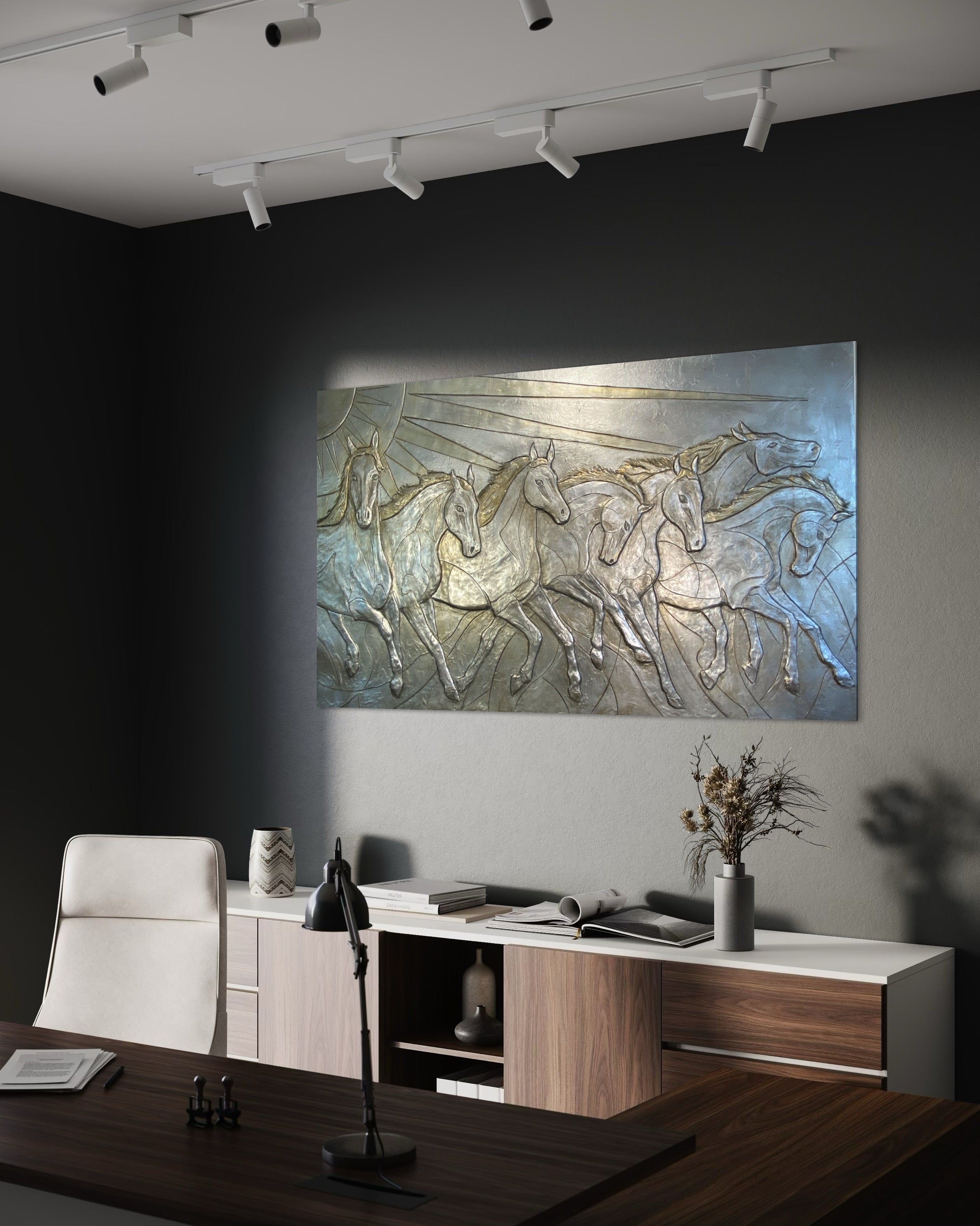 Modern office interior with a decorative wall piece of horses and a desk.