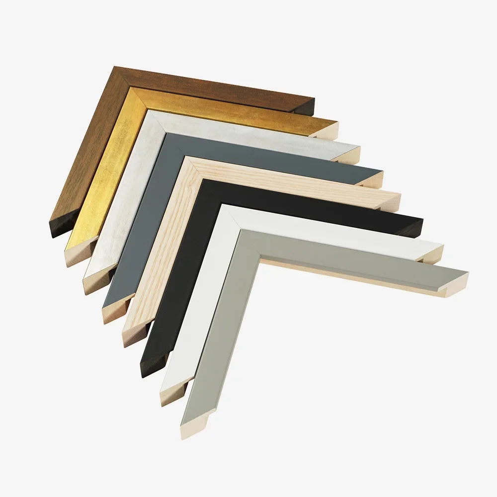 Set of wooden picture frames in various colors on a white background